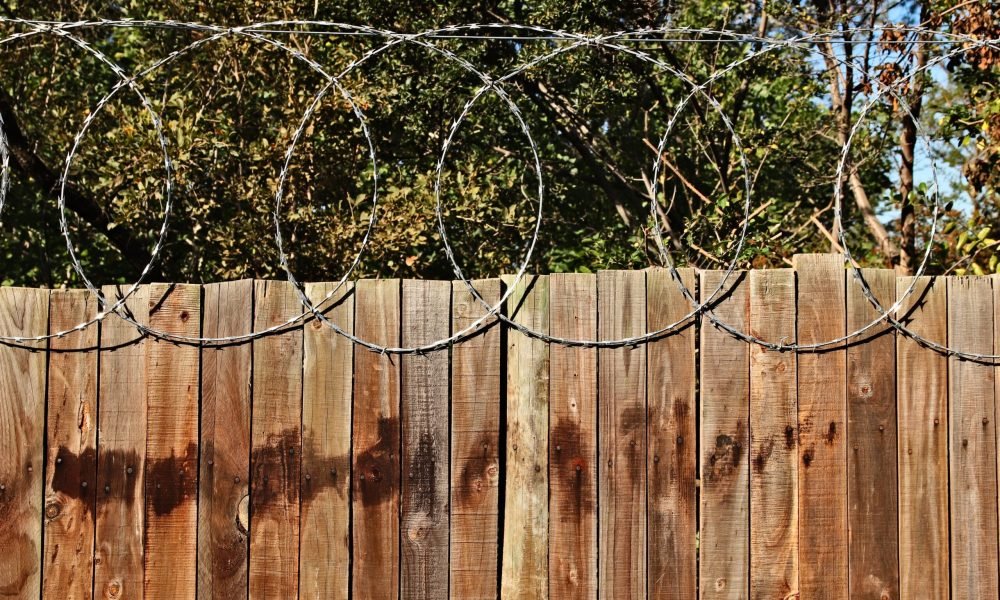 A closeup shot of a wooden fence with circles above